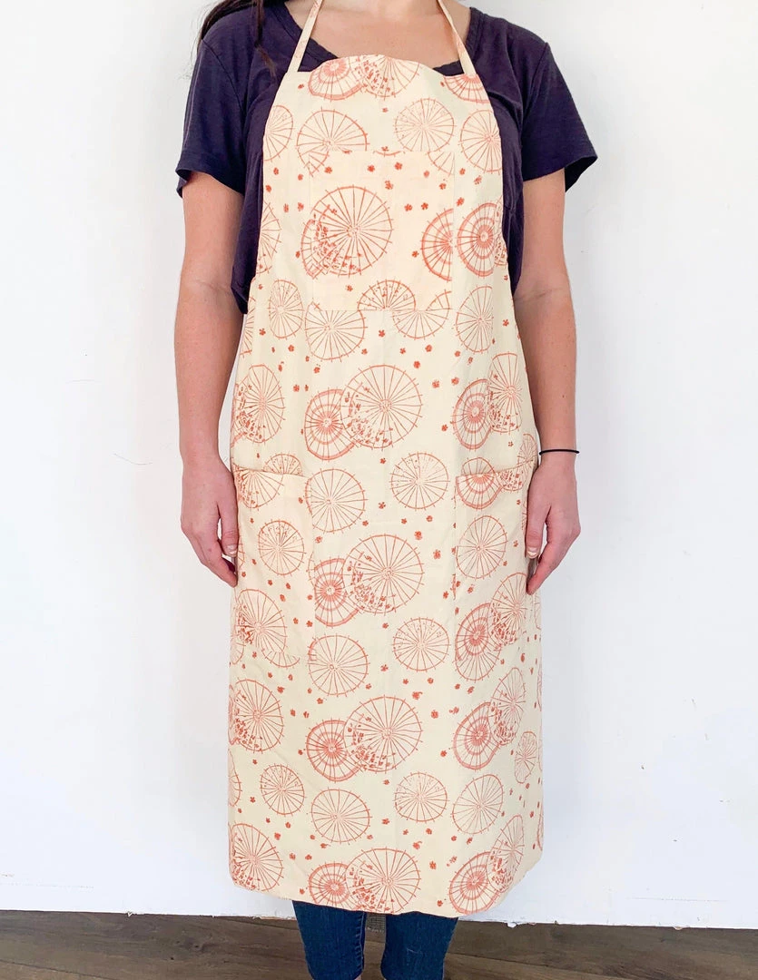 Symbology Dancing Umbrellas + Ginkgo Leaf Reversible Apron Home Goods 1 Symbology Dancing Umbrellas + Ginkgo Leaf Reversible Apron Home Goods